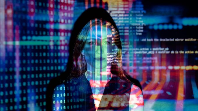 code projected over woman